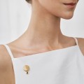 Gold pin with grey crystal from the Holos HOB14-2 ORSKA collection