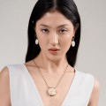 Hanging earrings on earwires with lotus flower from the Kembali collection KEK491 ORSKA-e