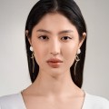 Long earrings with snake decoration and carved chrysanthemums from the Kembali collection KEK49-2-ORSKA-d