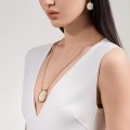Gold-plated pendant with a white carved rose from the Kembali collection