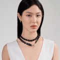 A short carved necklace from the Kembali collection by ORSKA