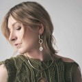 Long hoop earrings with an engraved phoenix pendant from the Tattoo collection by ORSKA jewelry