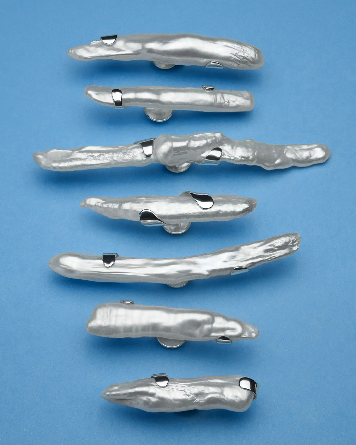 Silver pins with elongated baroque pearls