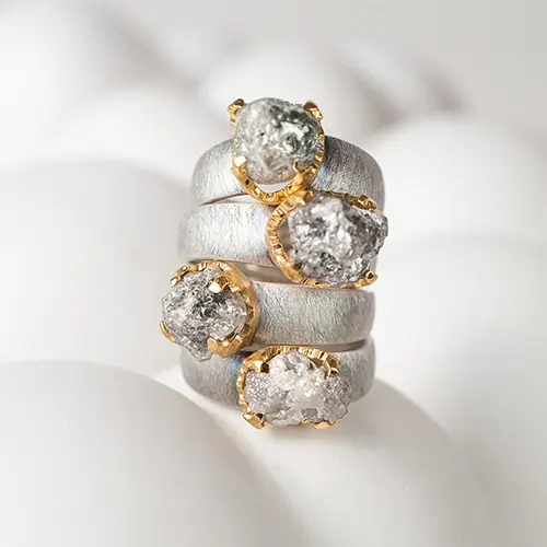 A silver ring with a dimond